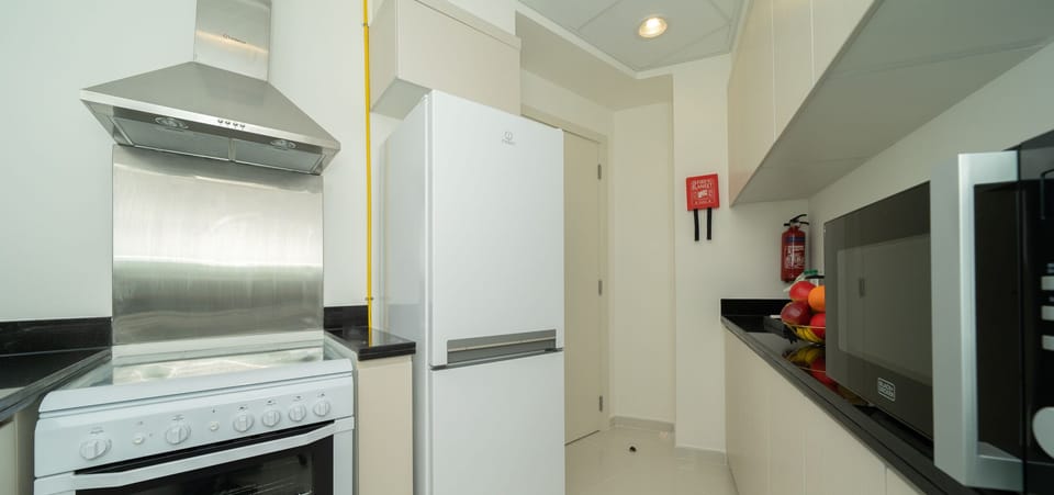 Deluxe Apartment | Private kitchen | Full-size fridge, microwave, oven, dishwasher