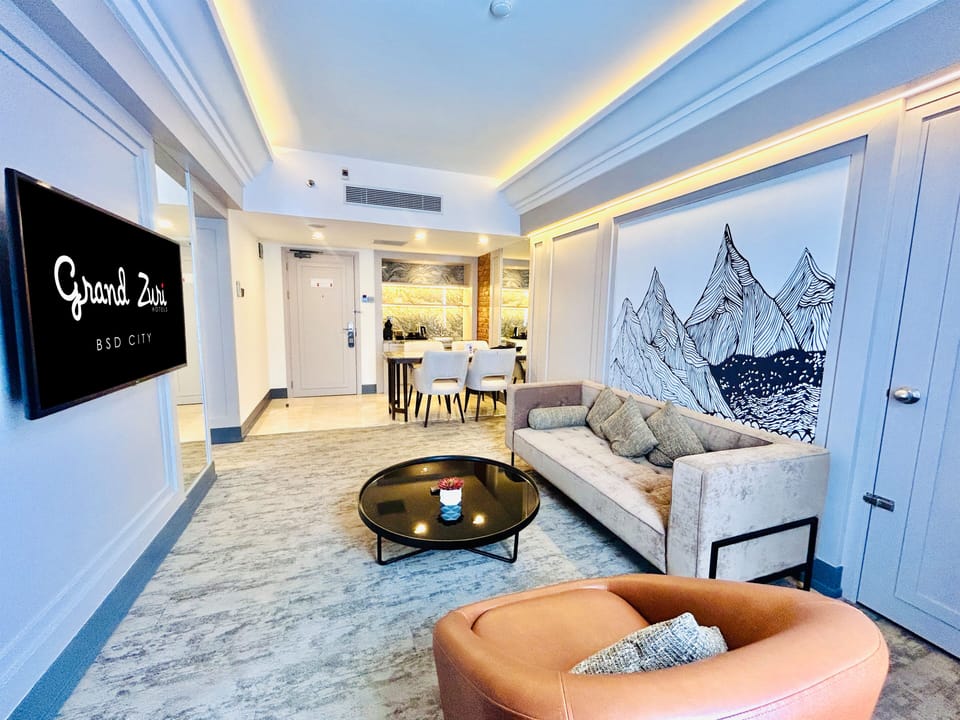 Junior Suite NON Smoking | Living area | 50-inch Smart TV with cable channels