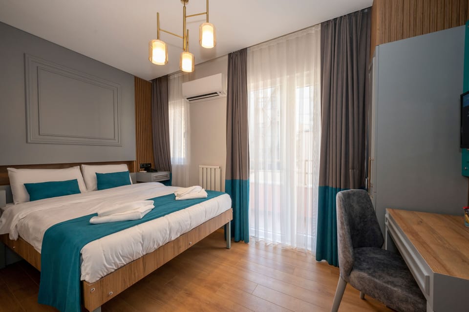 Deluxe Double Room, 1 King Bed, Balcony | In-room safe, laptop workspace, soundproofing, iron/ironing board