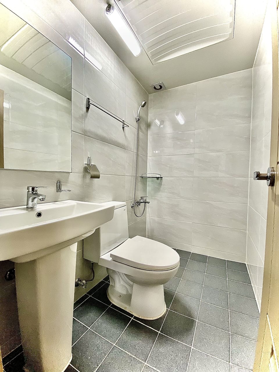 Shower, hair dryer, slippers, towels