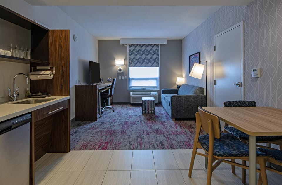 Suite, 1 King Bed with Sofa bed, Non Smoking | Private kitchen | Full-size fridge, microwave, coffee/tea maker, cookware/dishes/utensils