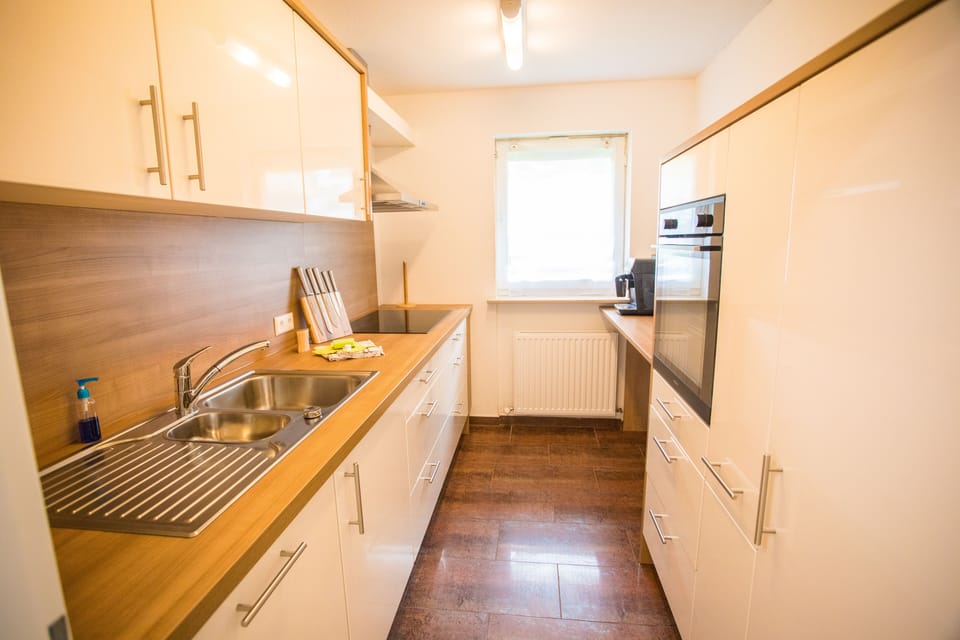 Luxury Condo | Private kitchen | Full-size fridge, microwave, oven, stovetop