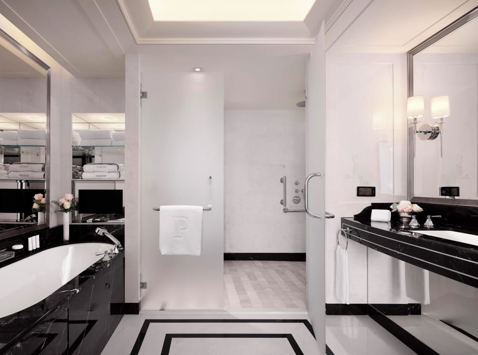 Superior Suite | Bathroom | Separate tub and shower, rainfall showerhead, designer toiletries