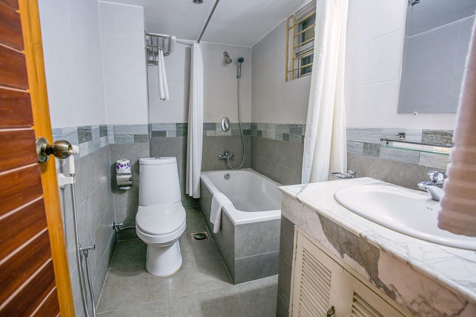 Shower, deep soaking tub, hair dryer, towels