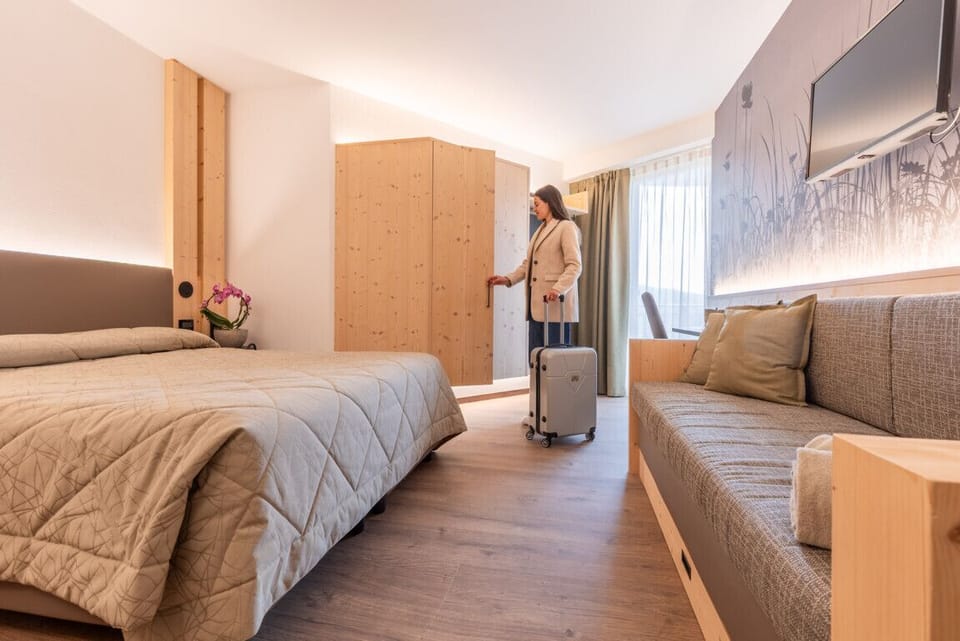 Deluxe Quadruple Room | Hypo-allergenic bedding, in-room safe, desk, laptop workspace