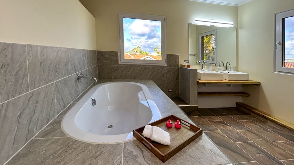 Deluxe Suite | Premium bedding, memory foam beds, in-room safe, individually decorated