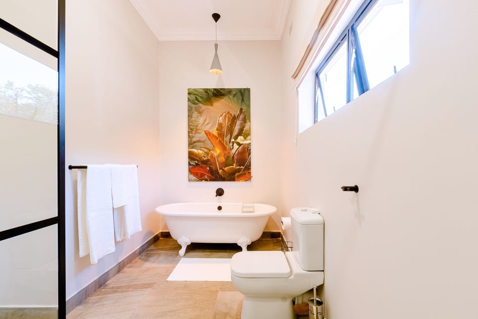 Separate tub and shower, rainfall showerhead, free toiletries