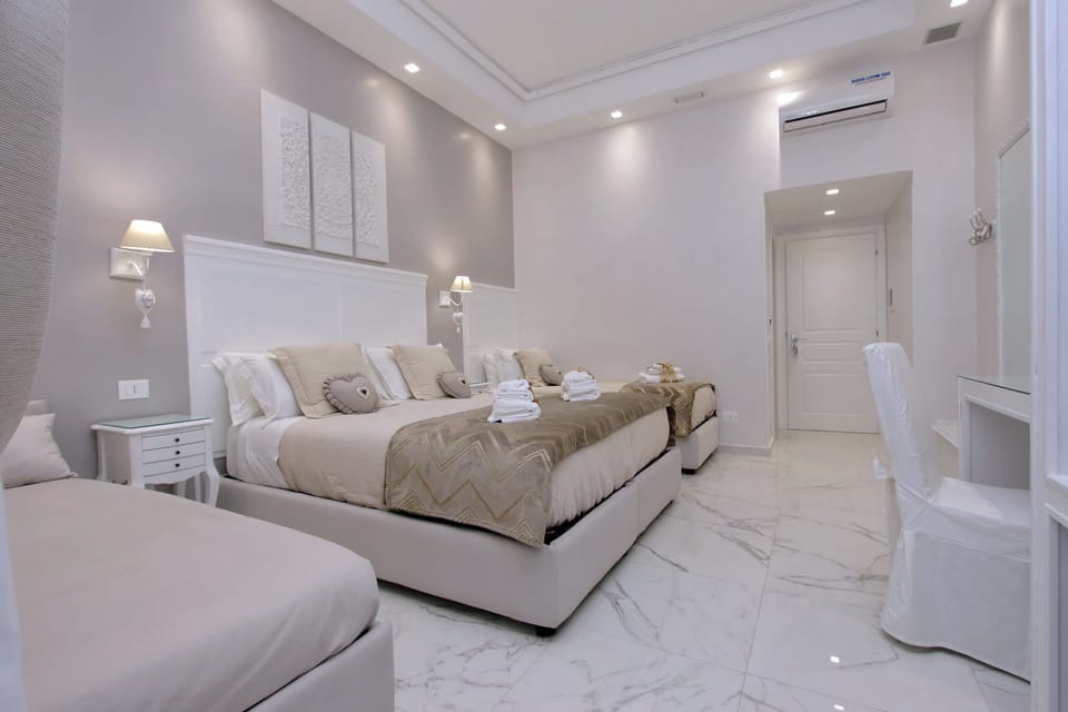 Superior Quadruple Room | In-room safe, desk, laptop workspace, blackout drapes