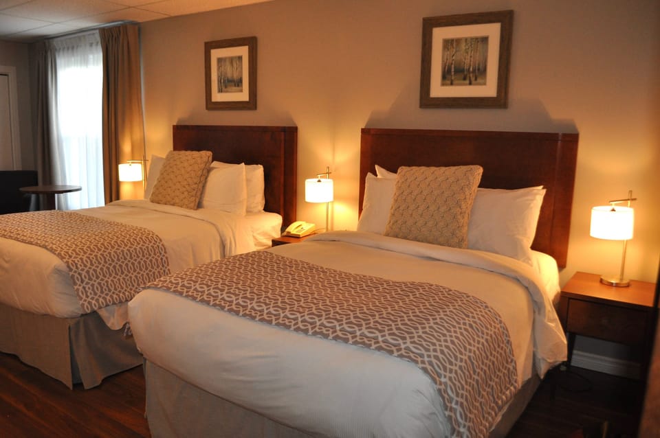Comfort Room, 2 Double Beds | Individually decorated, desk, blackout drapes, iron/ironing board