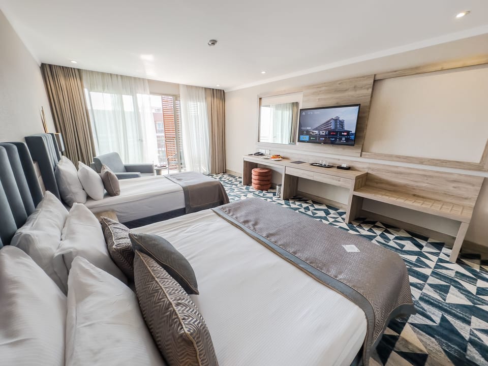 Premium bedding, minibar (free items), in-room safe, laptop workspace