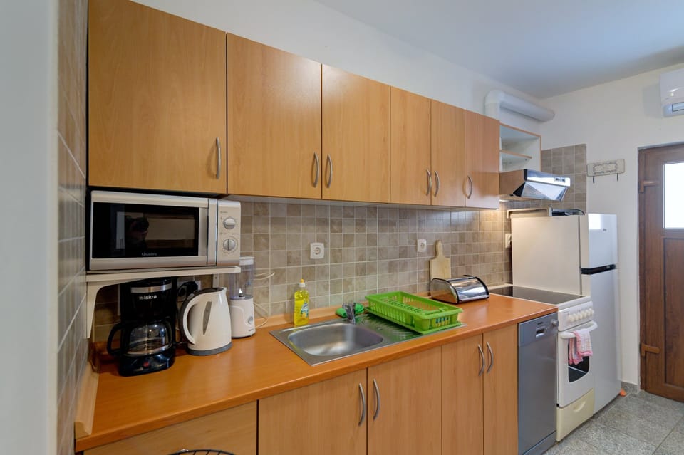 Apartment (Superior Two bedroom Apartment with T) | Private kitchen | Fridge