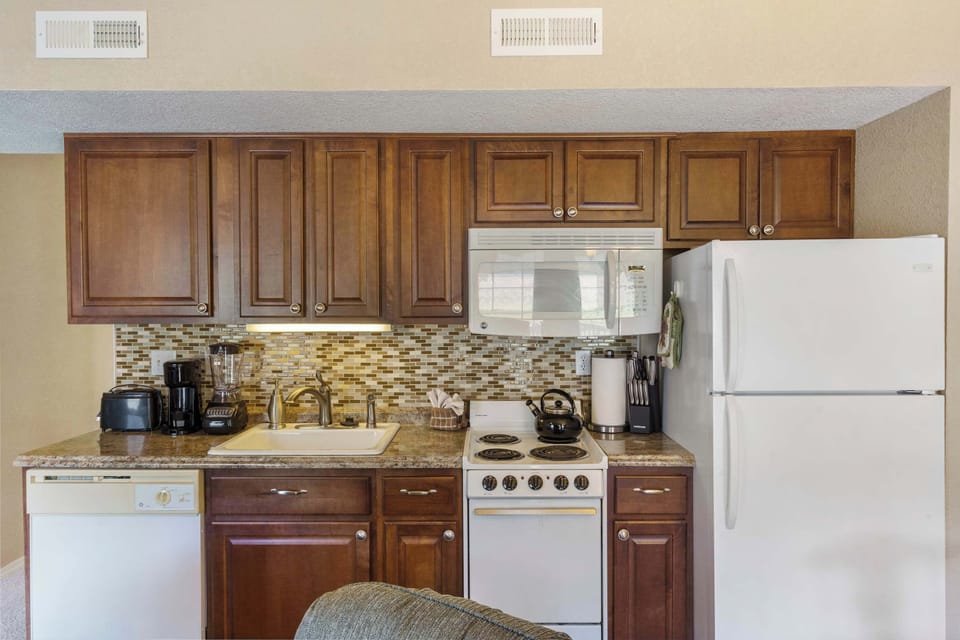 Condo, Multiple Beds, Balcony, Garden View (Journey Down Abby Lane ) | Private kitchen | Coffee/tea maker