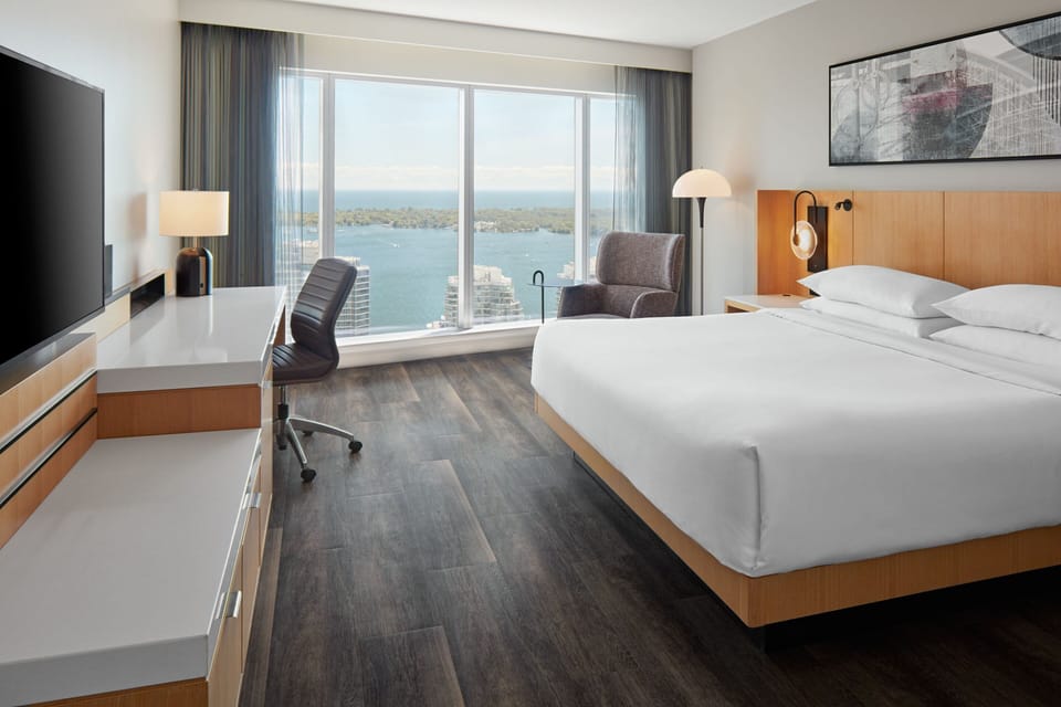 Room, 1 King Bed, Harbor View | In-room safe, desk, iron/ironing board, free cribs/infant beds