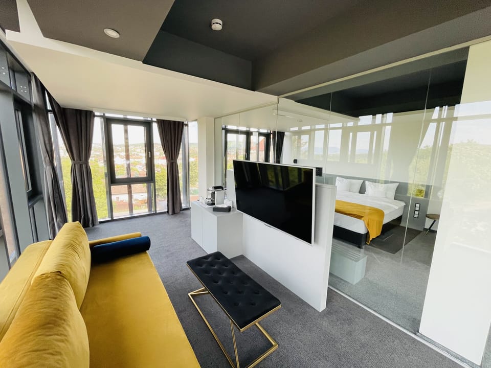 Panoramic Studio Suite, City View | Minibar, in-room safe, desk, laptop workspace