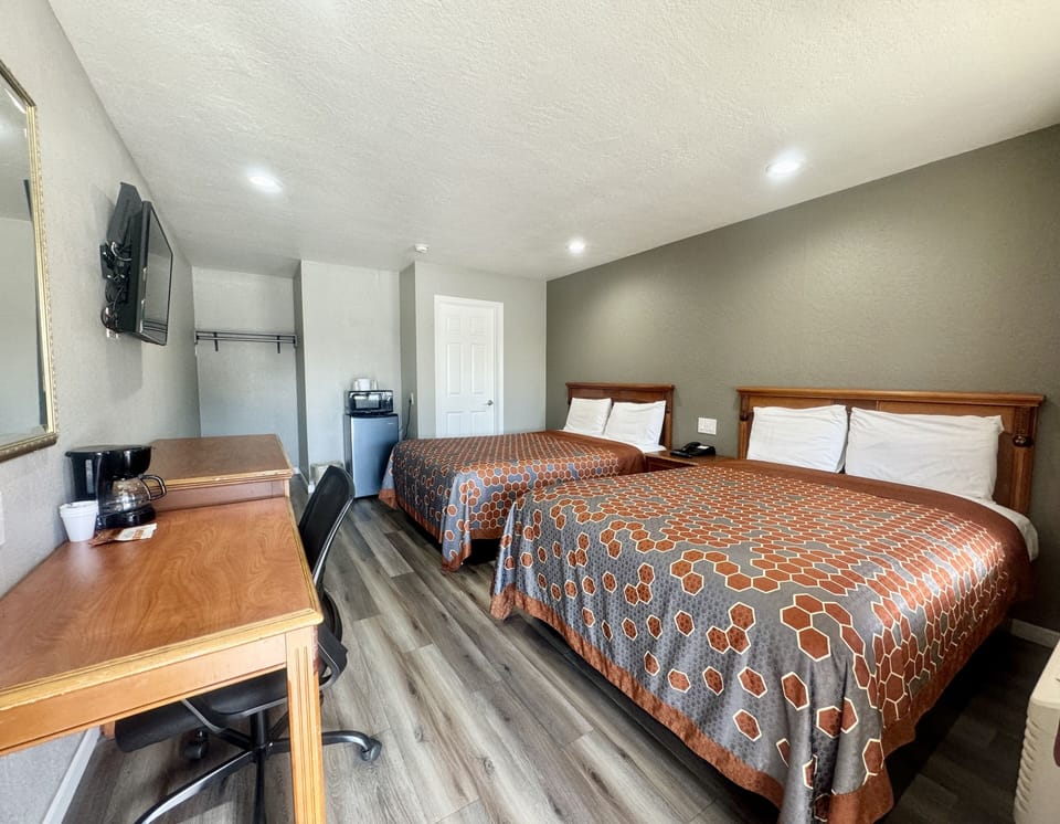 Room, 2 Queen Beds, Non Smoking | Desk, laptop workspace, WiFi (free), bed sheets