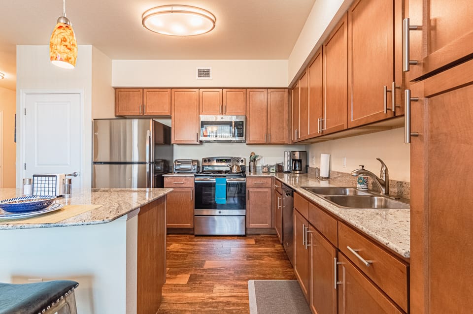 Deluxe Apartment | Private kitchen | Dining tables