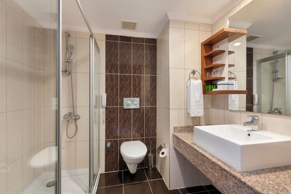 Shower, hair dryer, slippers, towels
