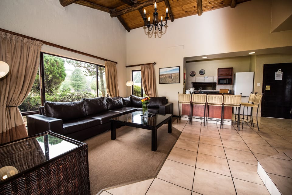 Chalet, 3 Bedrooms | Living room | TV, fireplace