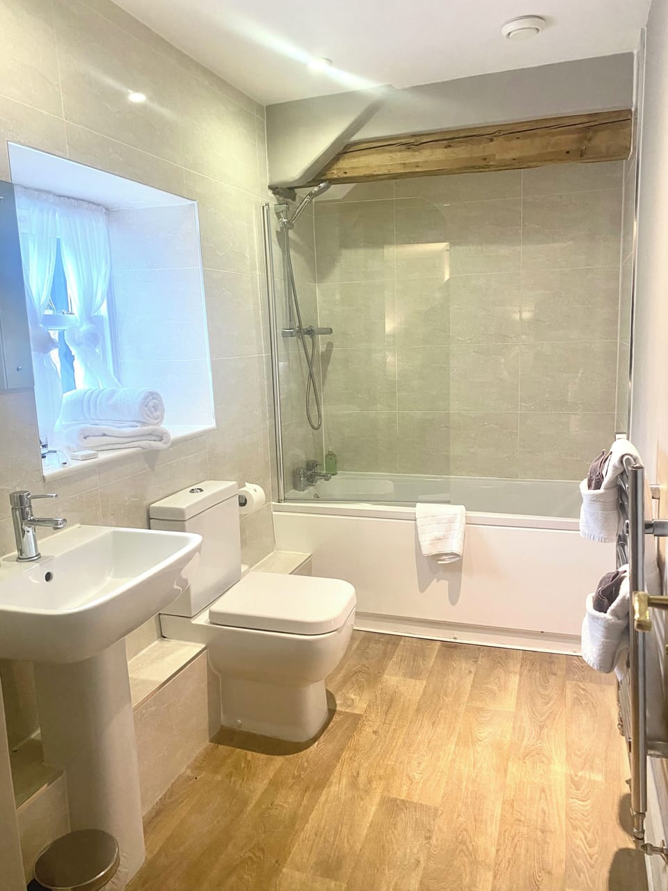 Combined shower/tub, rainfall showerhead, hair dryer, bathrobes