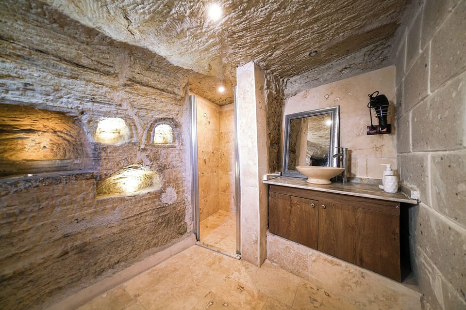 Cave Triple Room | Bathroom | Rainfall showerhead, designer toiletries, hair dryer, slippers