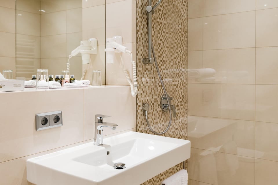 Shower, rainfall showerhead, eco-friendly toiletries, hair dryer