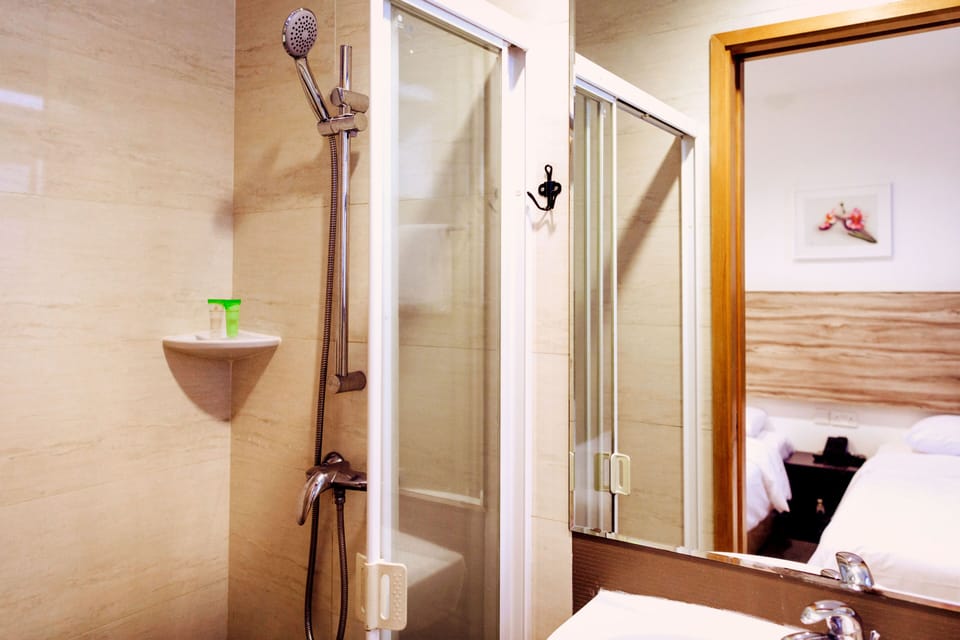Shower, free toiletries, hair dryer, slippers
