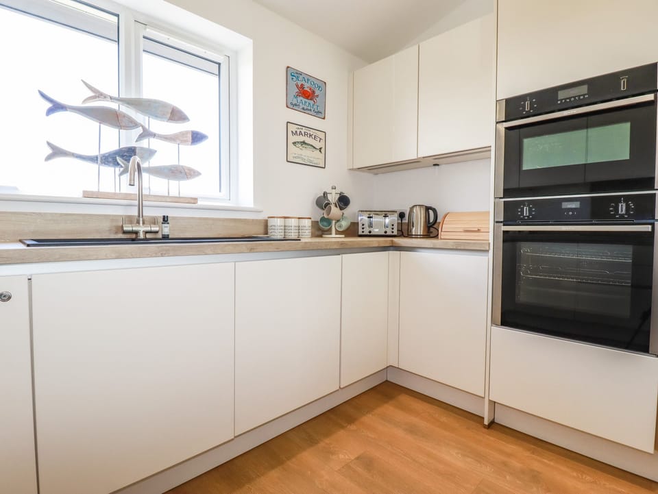 Fridge, electric kettle, toaster, cookware/dishes/utensils