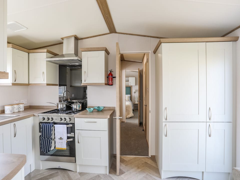 Fridge, electric kettle, cookware/dishes/utensils