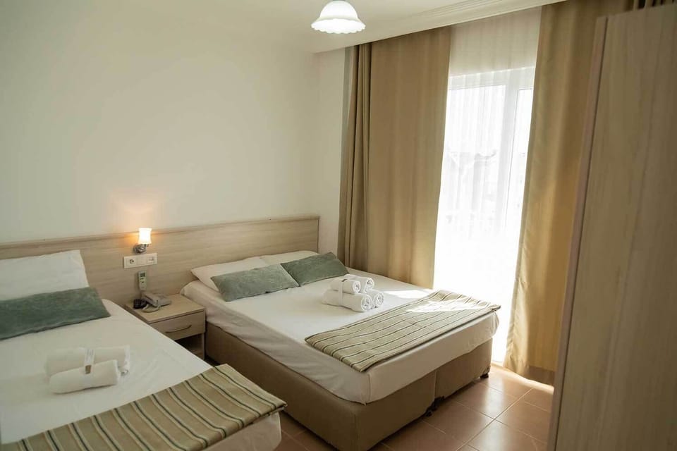 Deluxe Triple Room with Mountain and Sea View | 1 bedroom, premium bedding, free WiFi, bed sheets