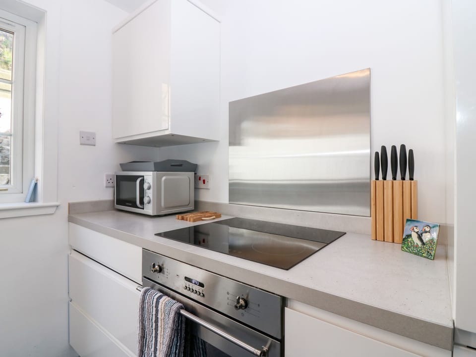 Fridge, electric kettle, toaster, cookware/dishes/utensils
