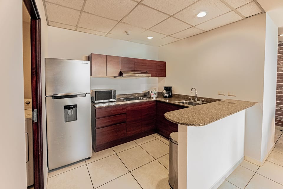 Family Suite, 2 Bedrooms, Kitchenette, City View (1 King Bed & 2 Twin Beds) | Private kitchen | Coffee/tea maker