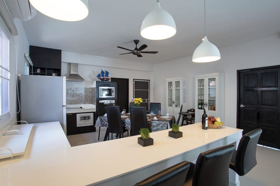 Deluxe Villa | Private kitchen | Fridge, microwave, stovetop, dishwasher