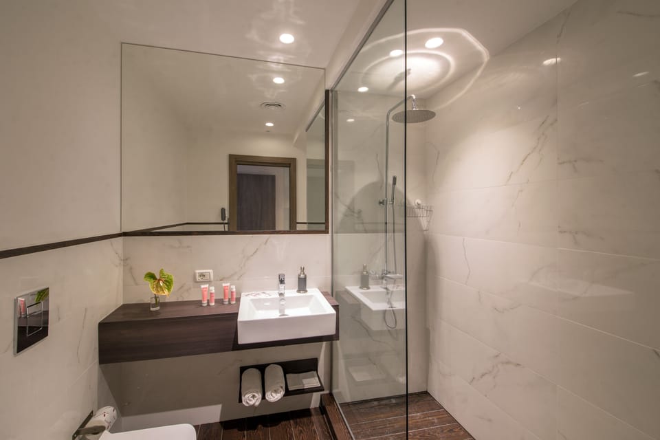 Triple Room, Balcony | Bathroom | Shower, rainfall showerhead, free toiletries, hair dryer