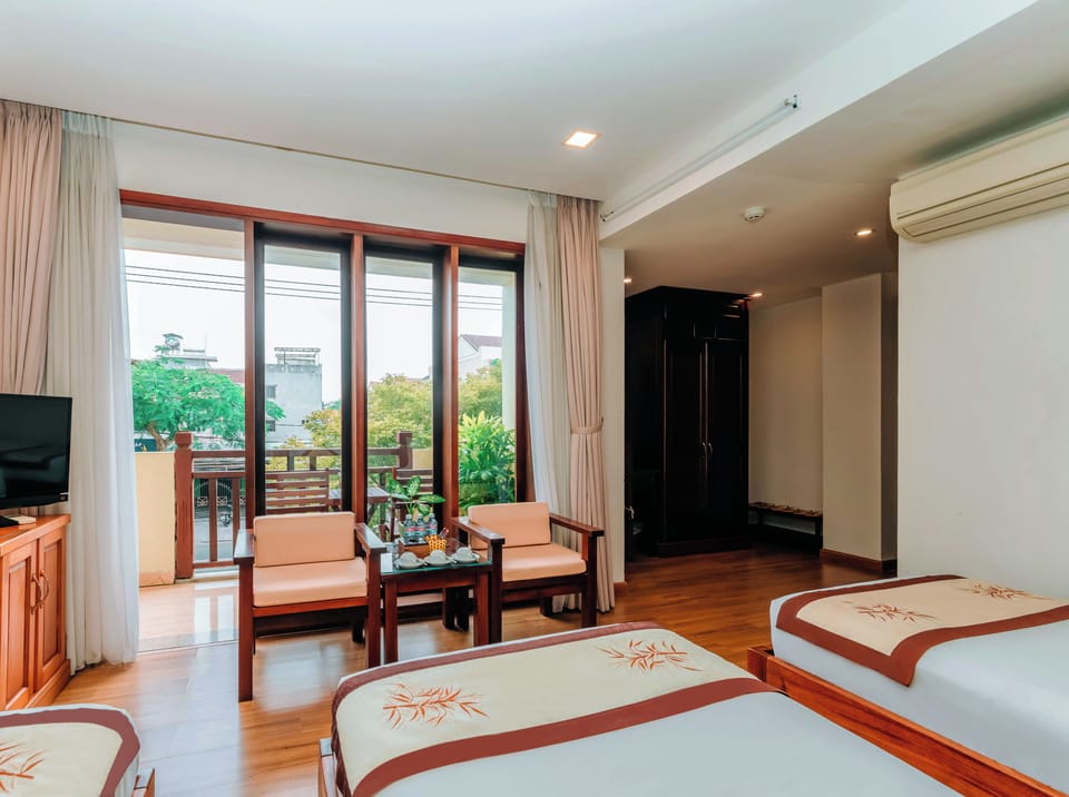 Triple Room | Minibar, in-room safe, desk, laptop workspace