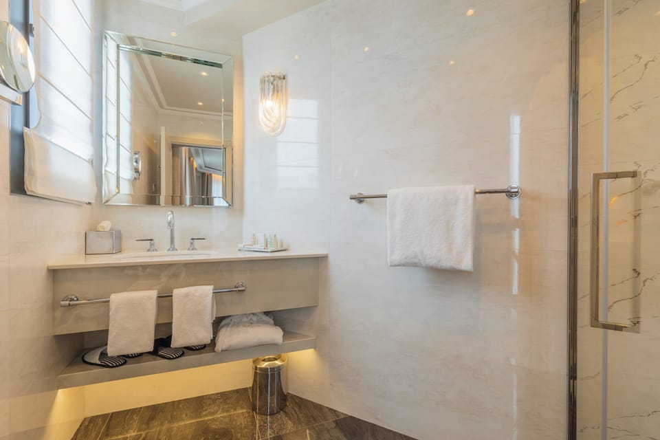 Designer toiletries, hair dryer, bathrobes, slippers