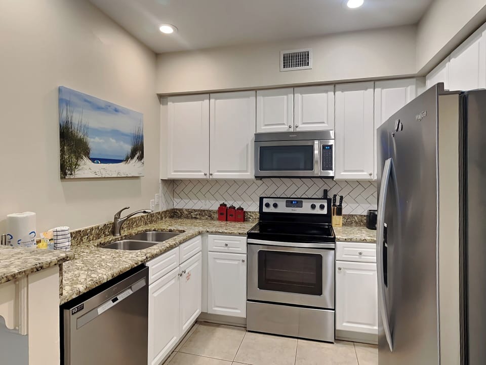 Condo, Multiple Beds, Balcony, Garden View (#511 - No Pets) | Private kitchen | Fridge, microwave, oven, stovetop