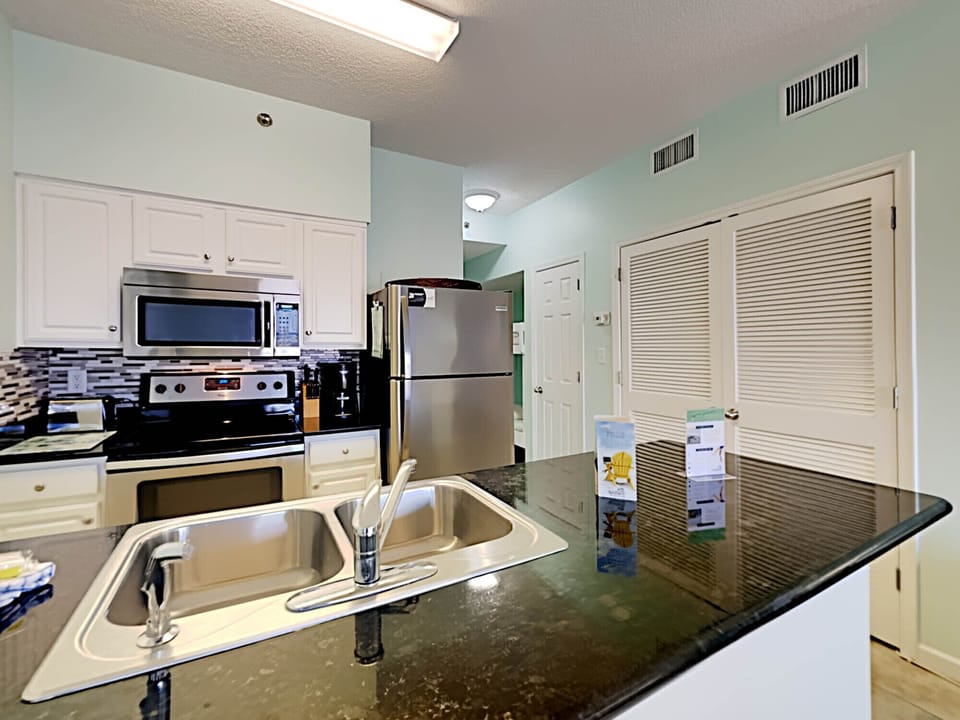 Condo, Multiple Beds, Balcony, Pool View (#002 - No Pets) | Private kitchen | Fridge, microwave, oven, stovetop