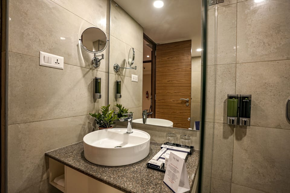 Sulit King Room | Bathroom | Shower, rainfall showerhead, designer toiletries, hair dryer