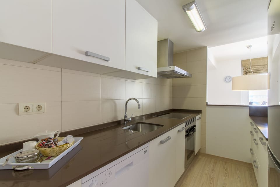 Full-size fridge, microwave, stovetop, cookware/dishes/utensils