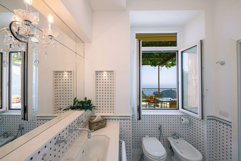 Suite, Sea View | Minibar, in-room safe, desk, blackout drapes