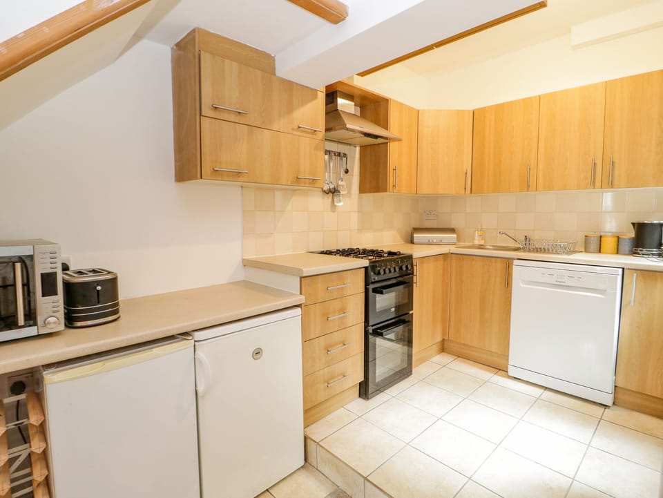 Fridge, dishwasher, electric kettle, cookware/dishes/utensils