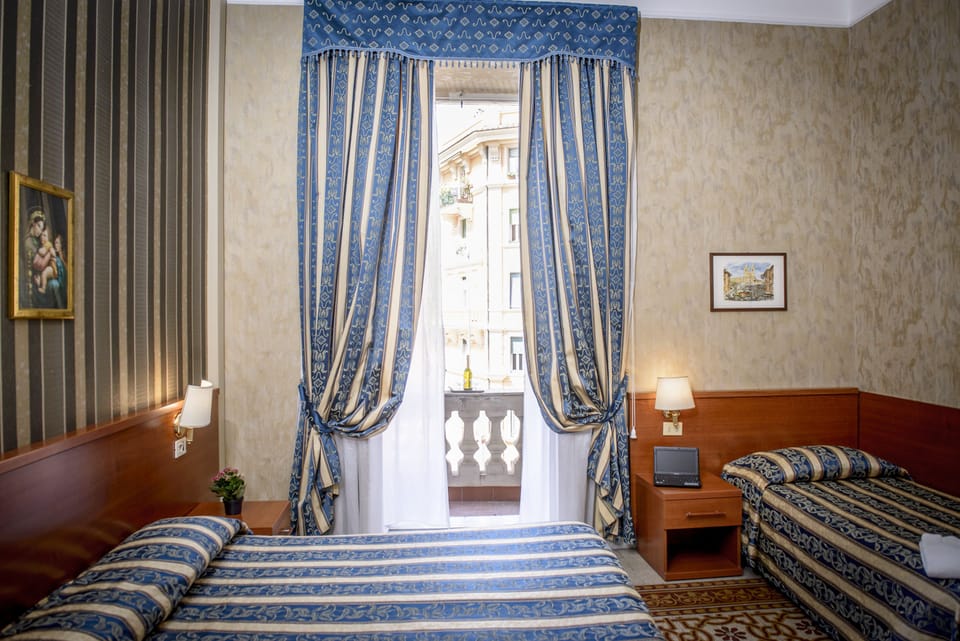 Triple Room | Minibar, in-room safe, desk, soundproofing
