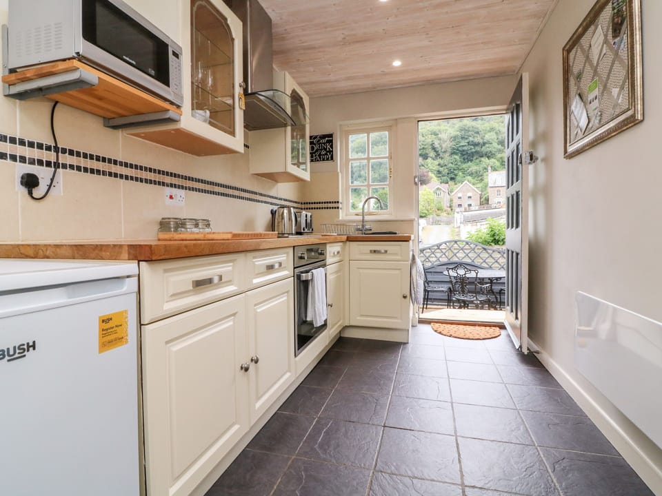 Fridge, electric kettle, toaster, cookware/dishes/utensils