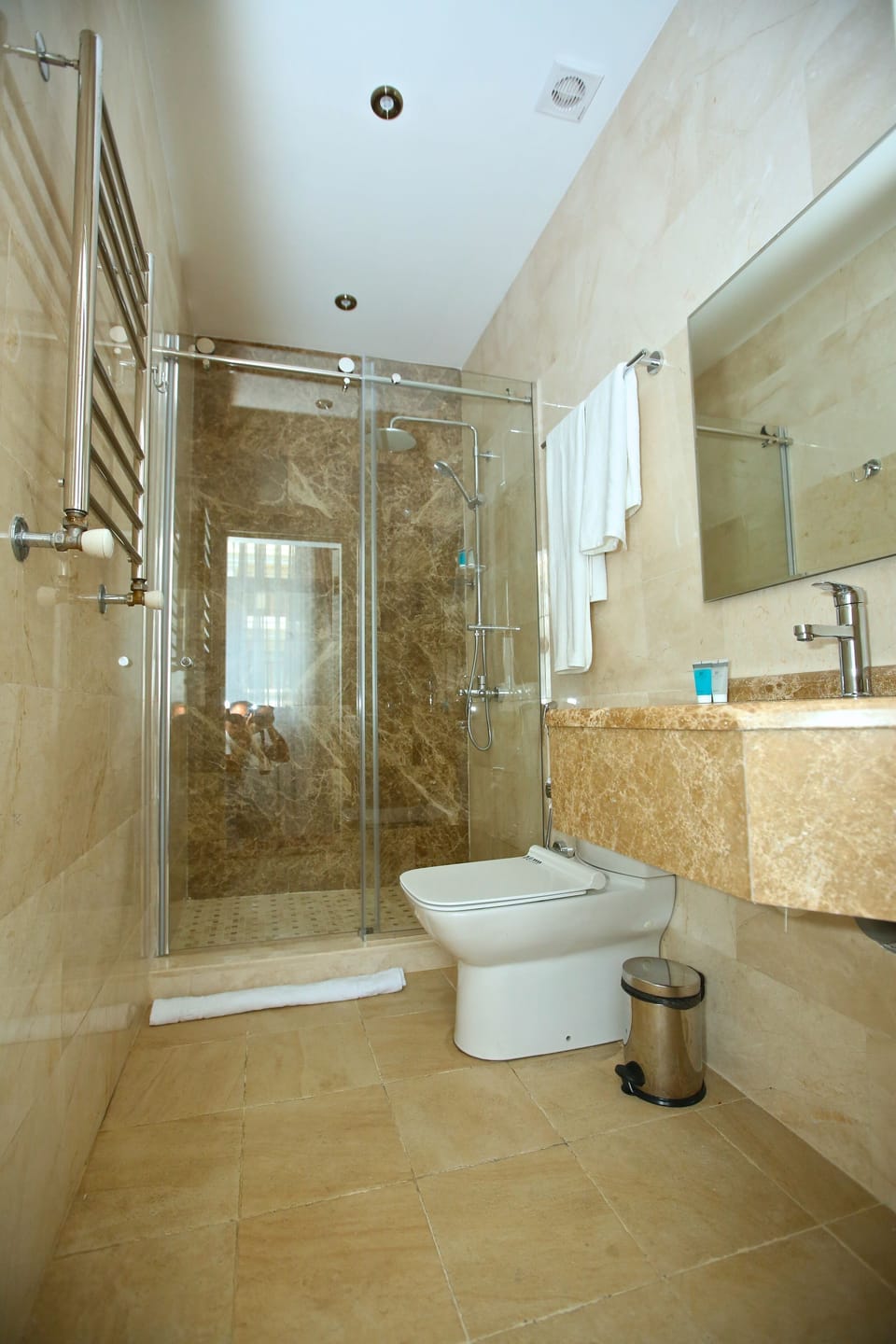Separate tub and shower, rainfall showerhead, hair dryer, bathrobes