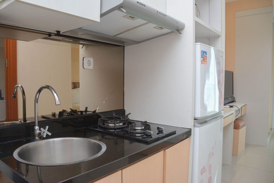 Fridge, stovetop, cookware/dishes/utensils, dining tables