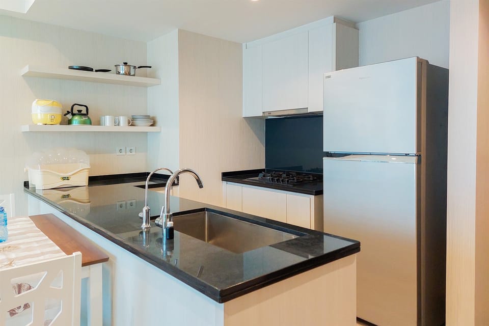 Fridge, stovetop, cookware/dishes/utensils, dining tables