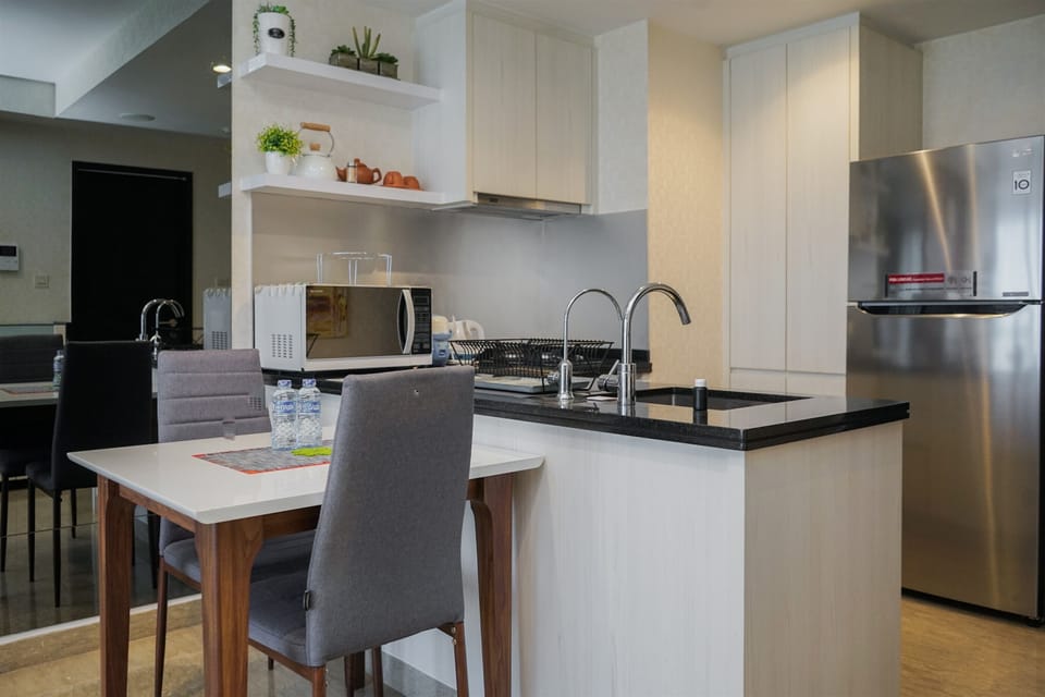 Apartment | Private kitchen | Fridge, microwave, stovetop, cookware/dishes/utensils