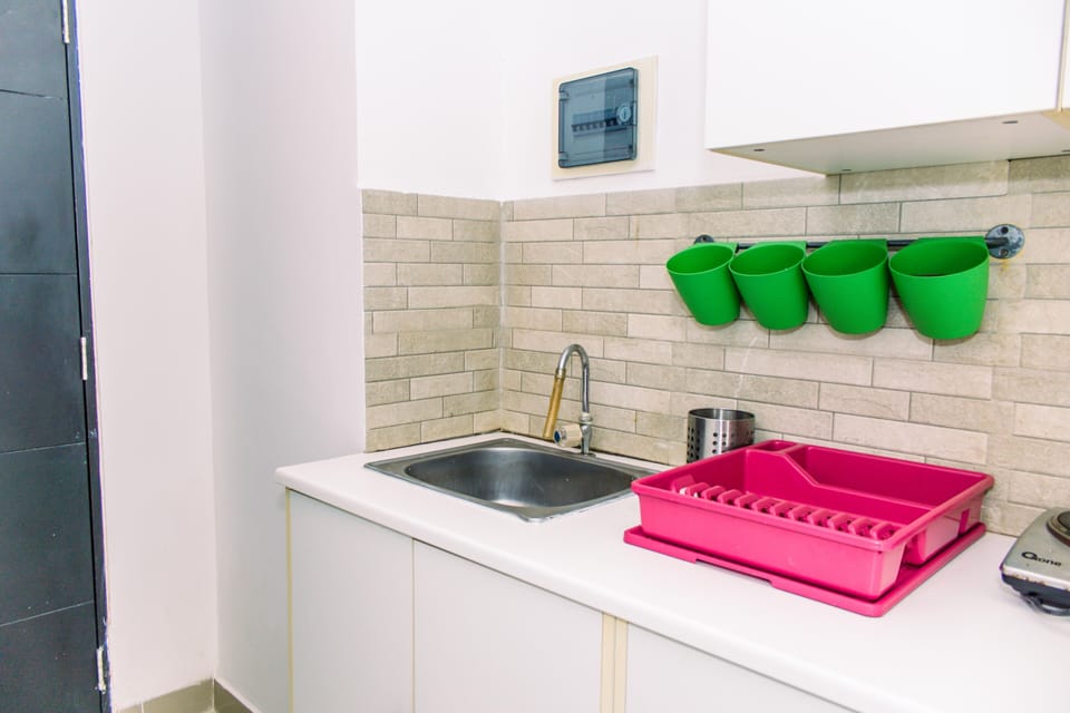 Fridge, stovetop, cookware/dishes/utensils, dining tables