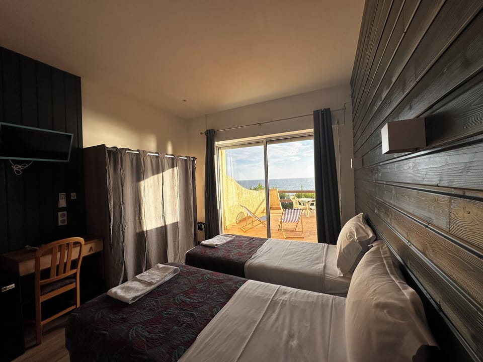 Comfort Room | Desk, laptop workspace, bed sheets