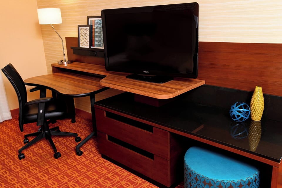 Desk, laptop workspace, blackout drapes, iron/ironing board